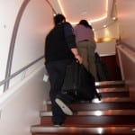 SAMSUNG DIGITAL CAMERA A porter lifting my bag up the stairs
