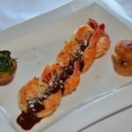 Grilled shrimp with hibiscus mole and corn cakes Grilled shrimp with hibiscus mole and corn cakes