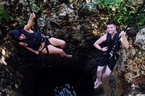Rappelling into a cenote Rappelling into a cenote at Jungle Maya