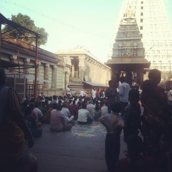 Inside the temple. Washing the elephant statue.