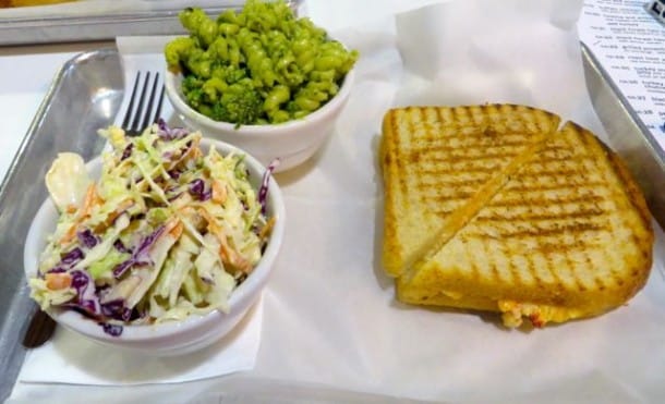 Pimento grilled cheese sandwich with tasty side dishes at Parker & Otis