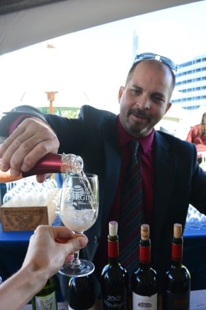 The sommelier pouring the Trump Sparkling Rose