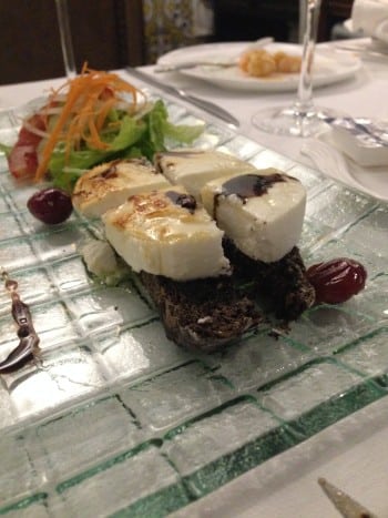 Goat cheese and acacia honey served on toast with lettuce and balsamic vinegar