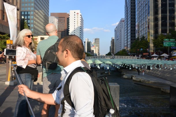 A selfie stick user is capturing his Seoul, South Korea memories (Credit: Caitlin Martin)