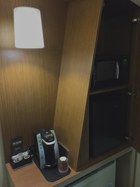 Keurig and cabinet (with fridge and microwave) in my room