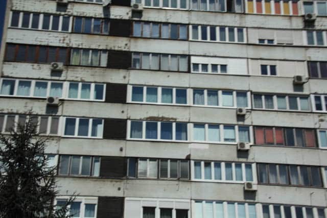 Typical communist era style apartments with bullet marks