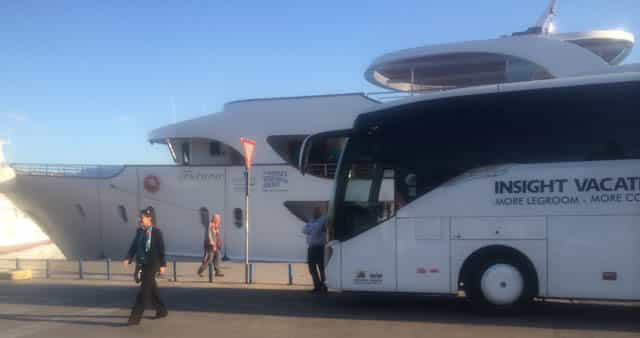 Insight's luxury coach alongside one of its touring vessels
