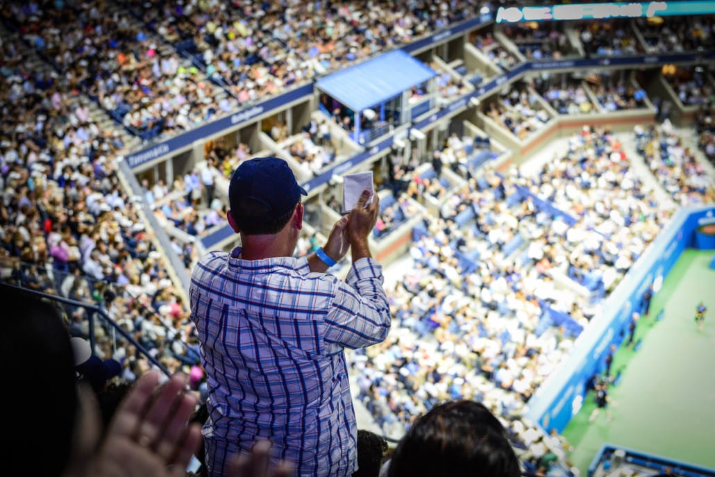 A fan cheers Roger Federer and Richard Gasquet playing during the quarterfinals
