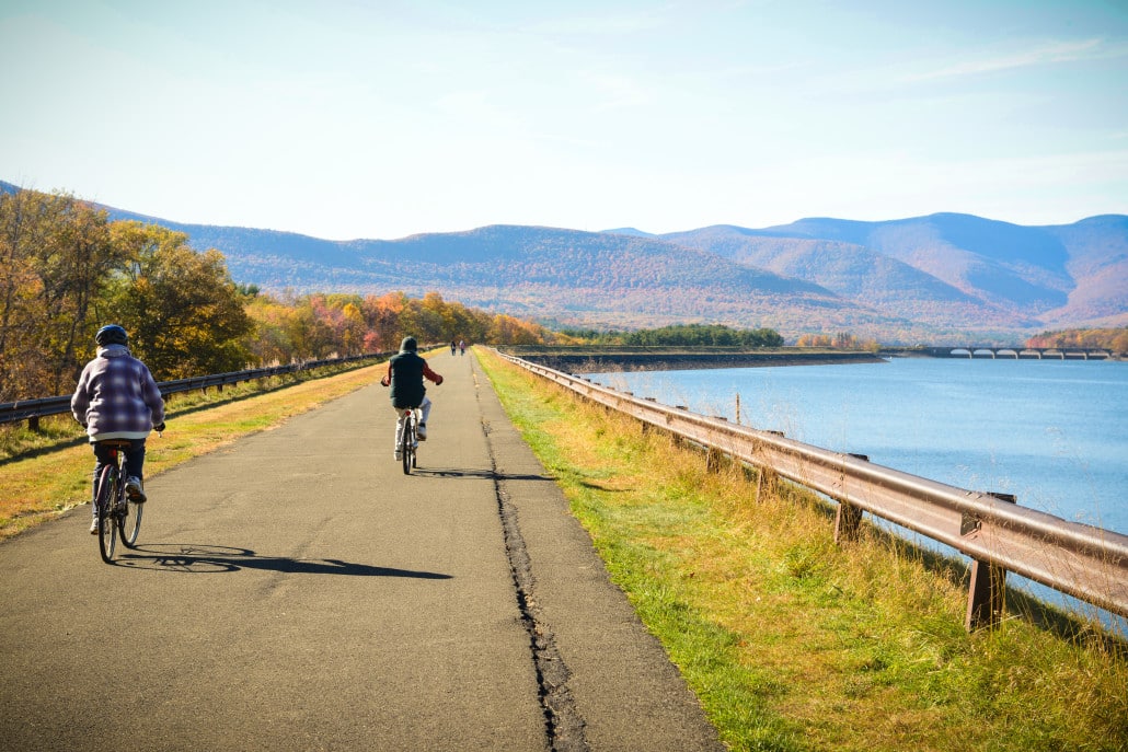 Cyclists make their way across the Ashokan Walkway