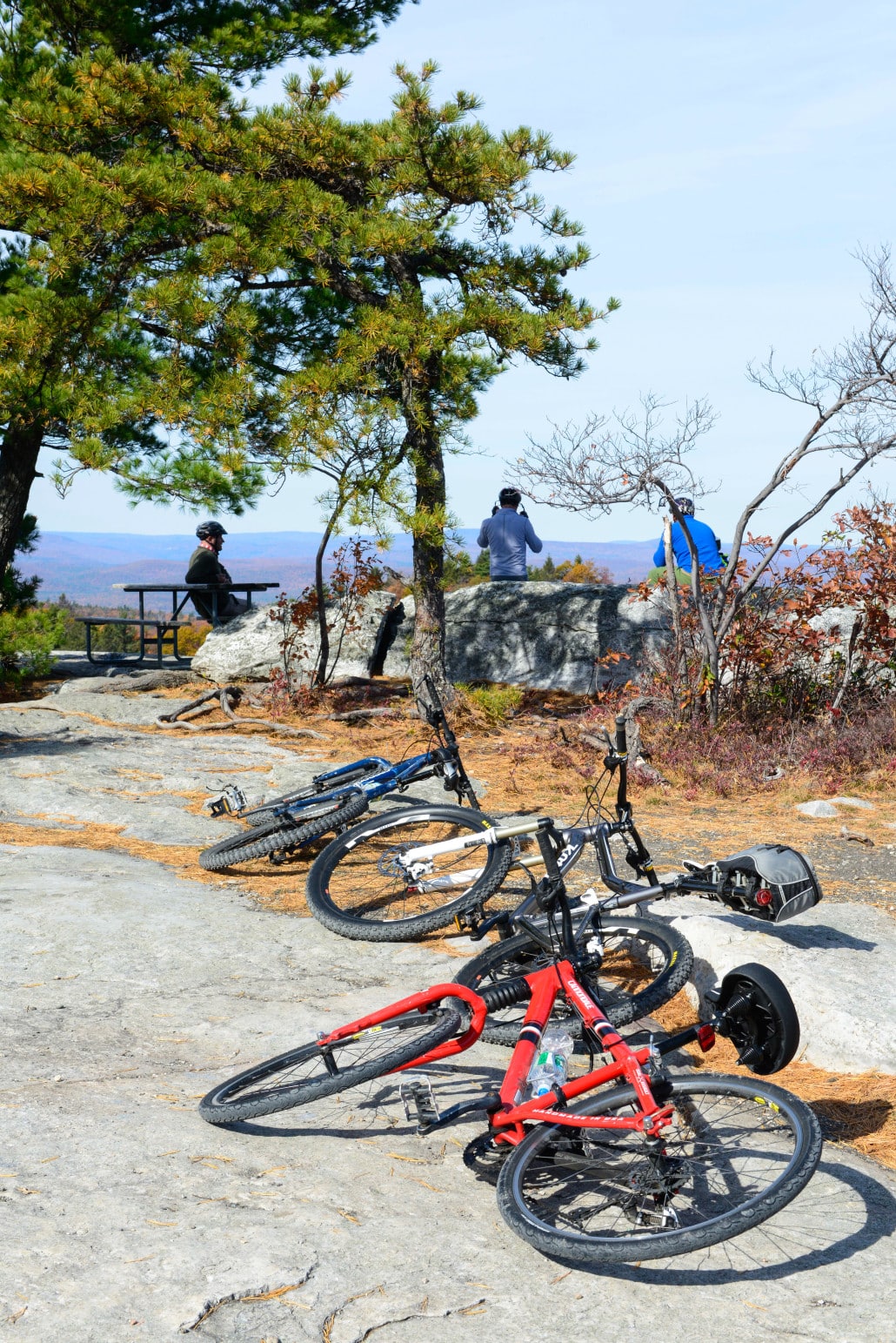 Cyclists pull over and look out over Lake Minnewaska