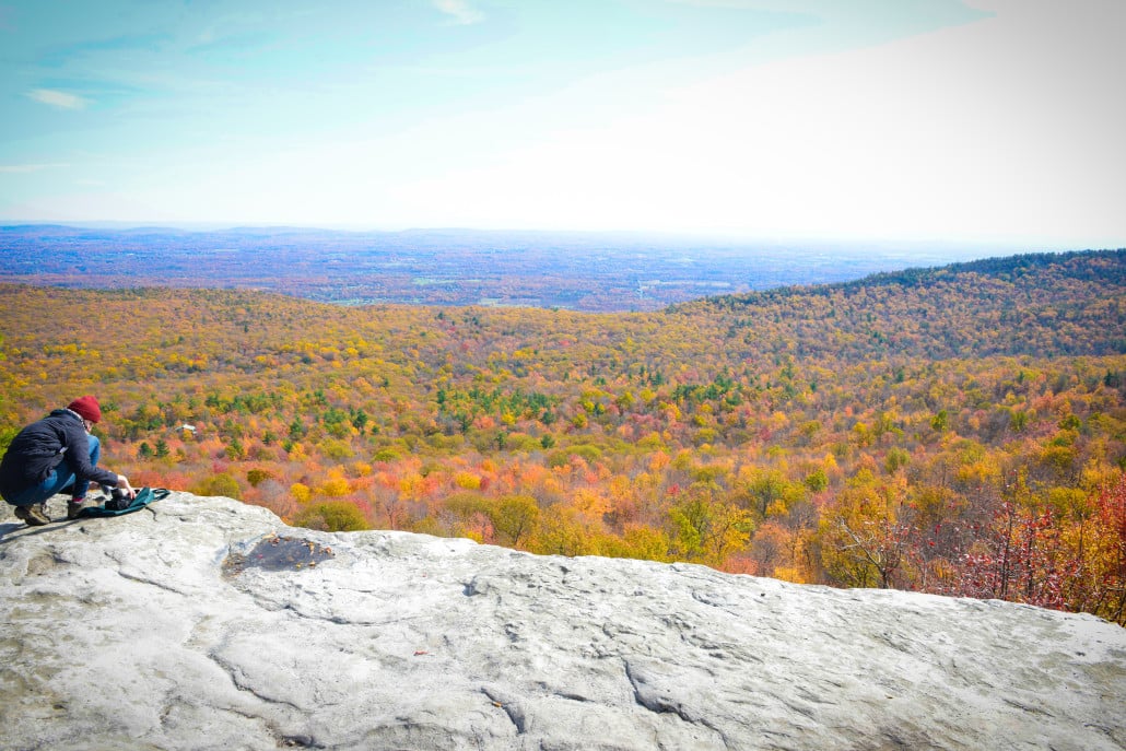 A visitor to Minnewaska State Park looks out over the Hudson Valley from atop the Shawangunk Ridge