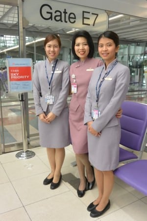Gate agents, smiling for photos