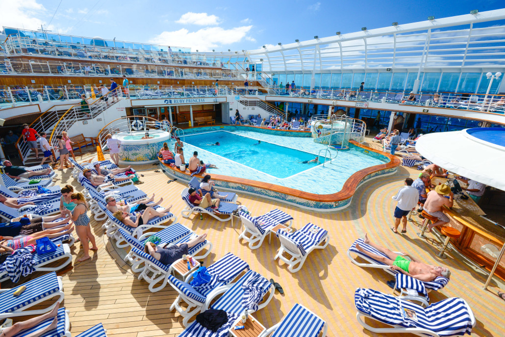 Sunbathers lounge near one of four pools on the Ruby Princess