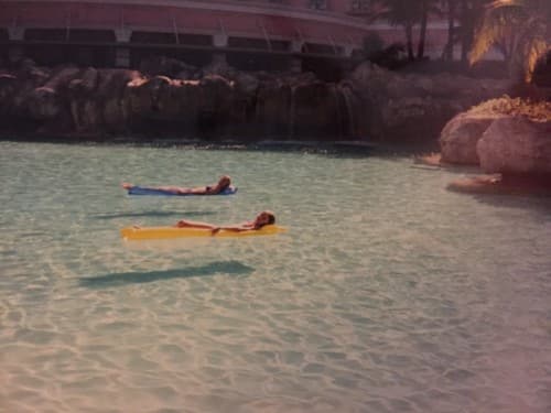 My sister and I lounging in the pool near Coral Towers in December 1997