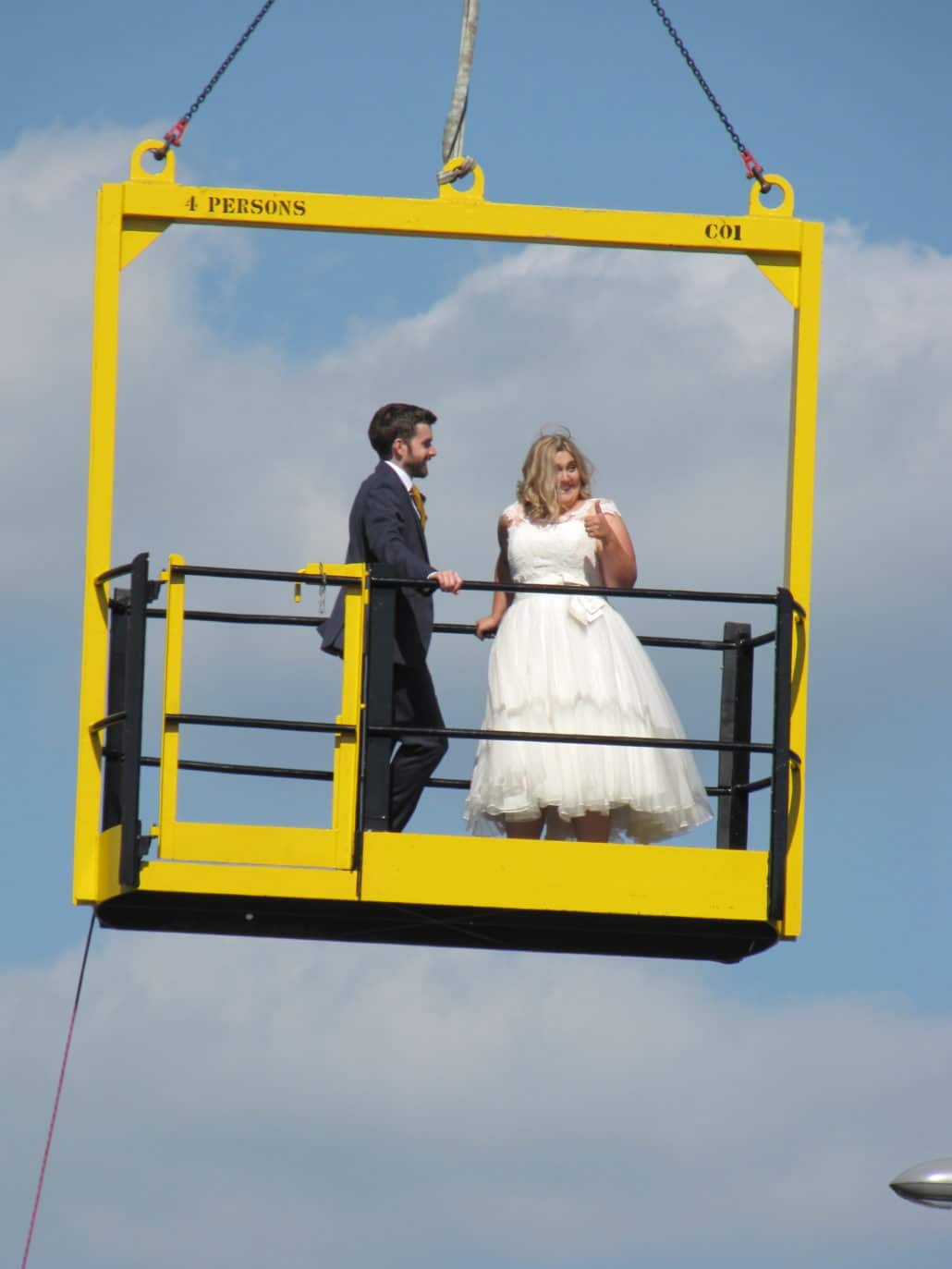 A newlywed couple make a grand entrance to a rooftop party on Bristol Harbour