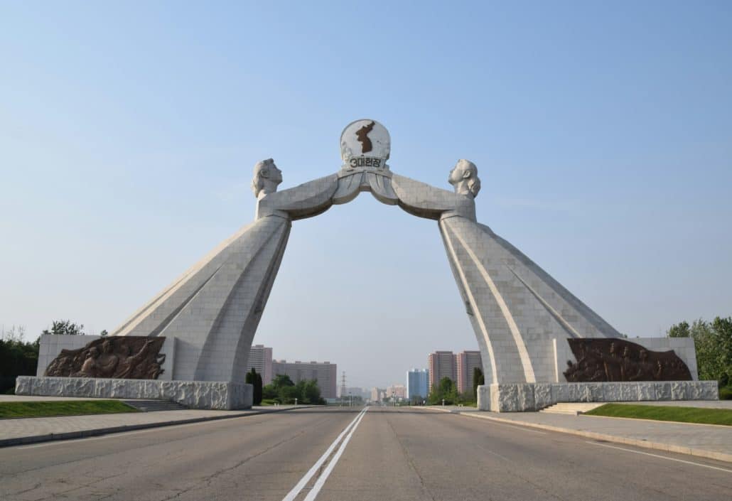 Pyongyang's Arch of Reunification, built in 1991, consists of two women in traditional Korean dress bending over towards each other