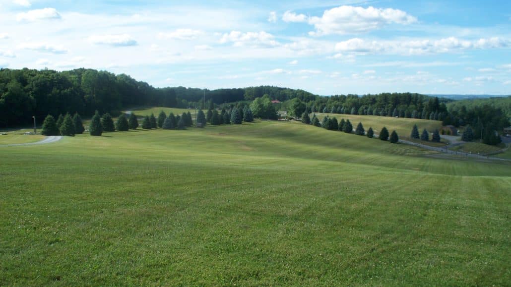 The meadow where Woodstock took place with the place where the stage was set in the far background