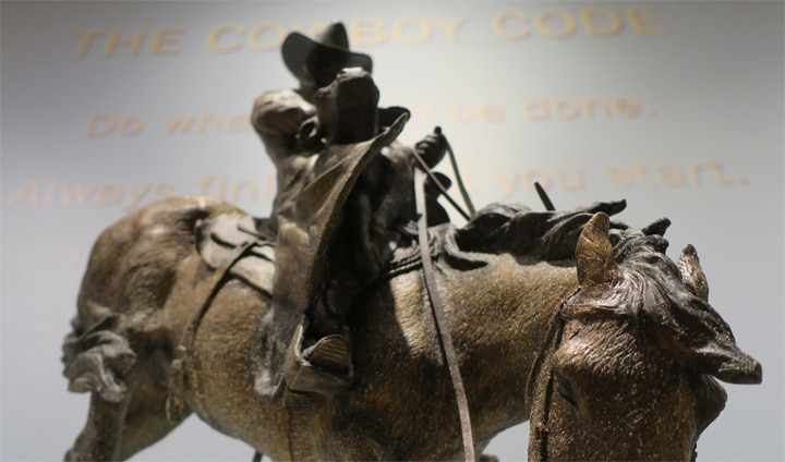 A bronze statue in the Cowboy Gallery at the Booth Museum