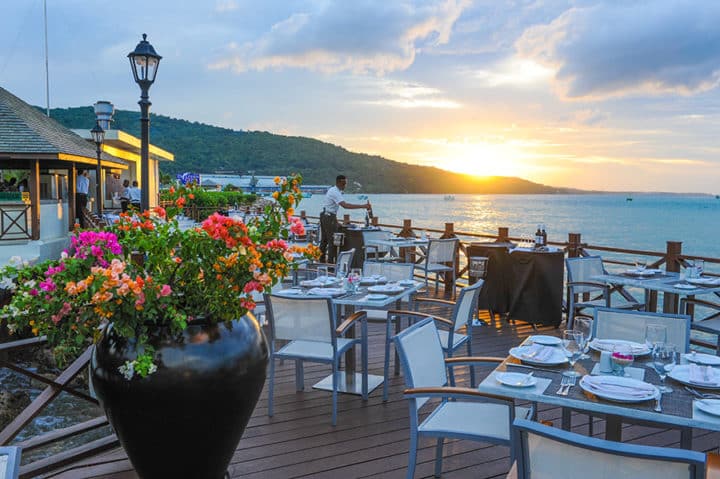 Outdoor dining overlooking the cove at Moon Palace Jamaica