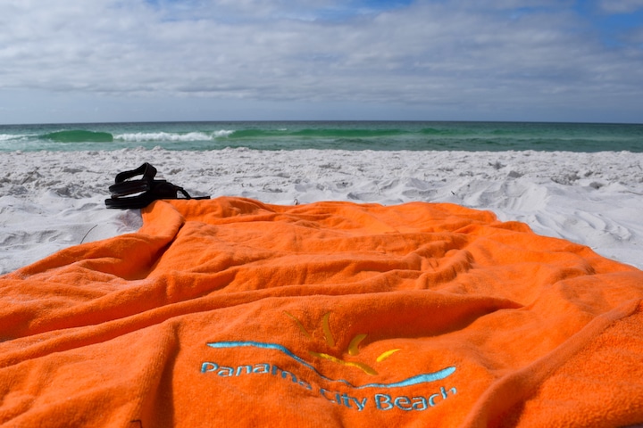 Grab your towel and make camp in the soft, white sand in Panama City Beach