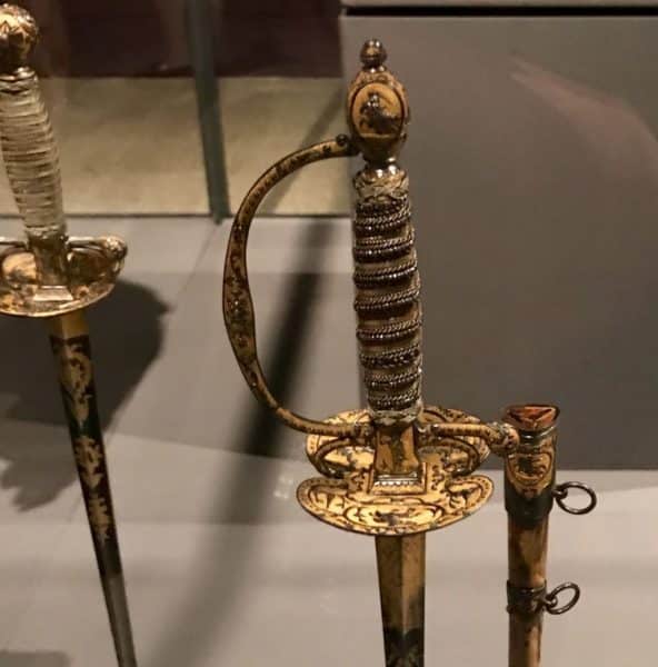 Jewel-encrusted swords at "Visitors to Versailles"