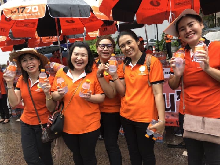 Volunteers giving out complimentary water