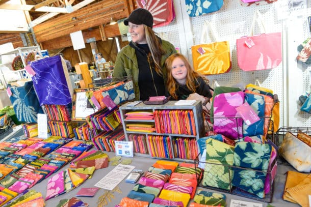Vendor Amy Healy, with the help of her niece Kaci, sells Healy Originals at the Olympia Farmers Market