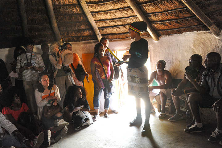 Tour guide Slender Moipone shows visitors from America a Pedi tribe homestead