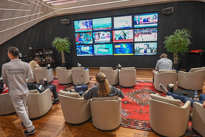 TV news room with wandering massage therapists